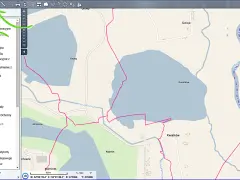 Mapa ewidencyjna z zaznaczonymi granicami obrębów, działkami ewidencyjnymi i budynkami. Widoczne są również hydrografia i nazwy miejscowości.